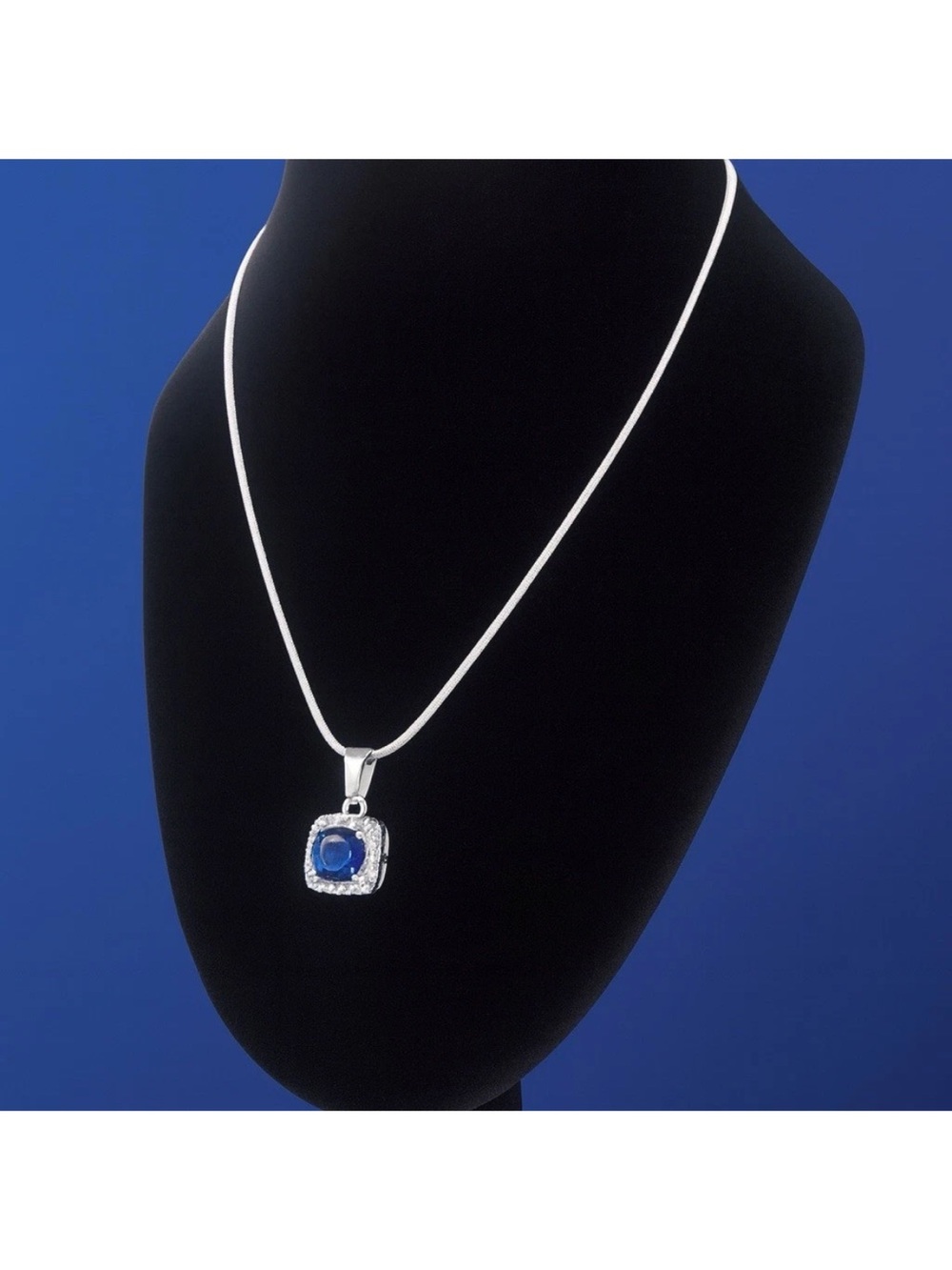 Blue Topaz Pendant w Halo Accents